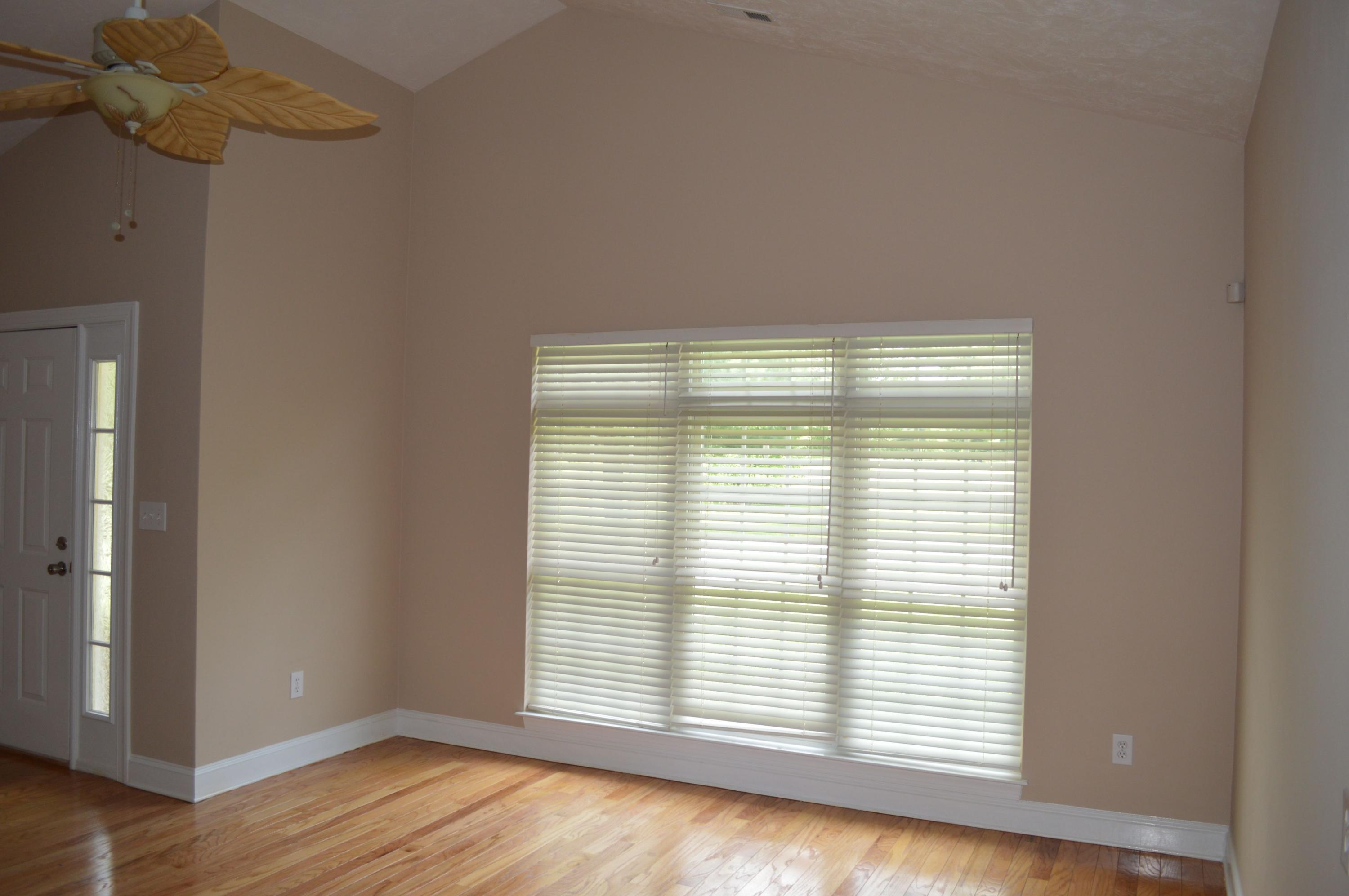 2231 Countryside Road Northwest Roanoke, VA 24017 - Photo 6 of 28 a view of an empty room with wooden floor and a window