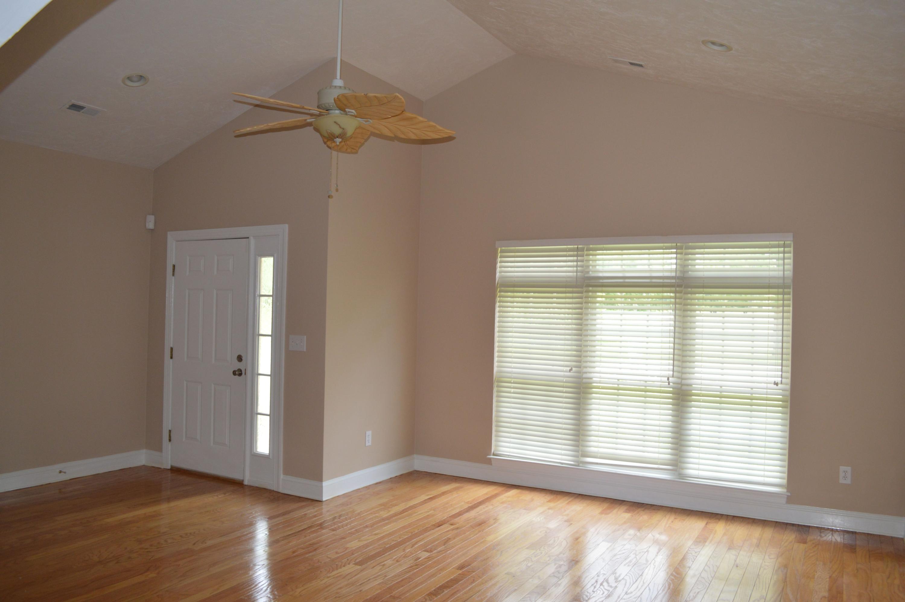 2231 Countryside Road Northwest Roanoke, VA 24017 - Photo 7 of 28 a view of an empty room with wooden floor and a window