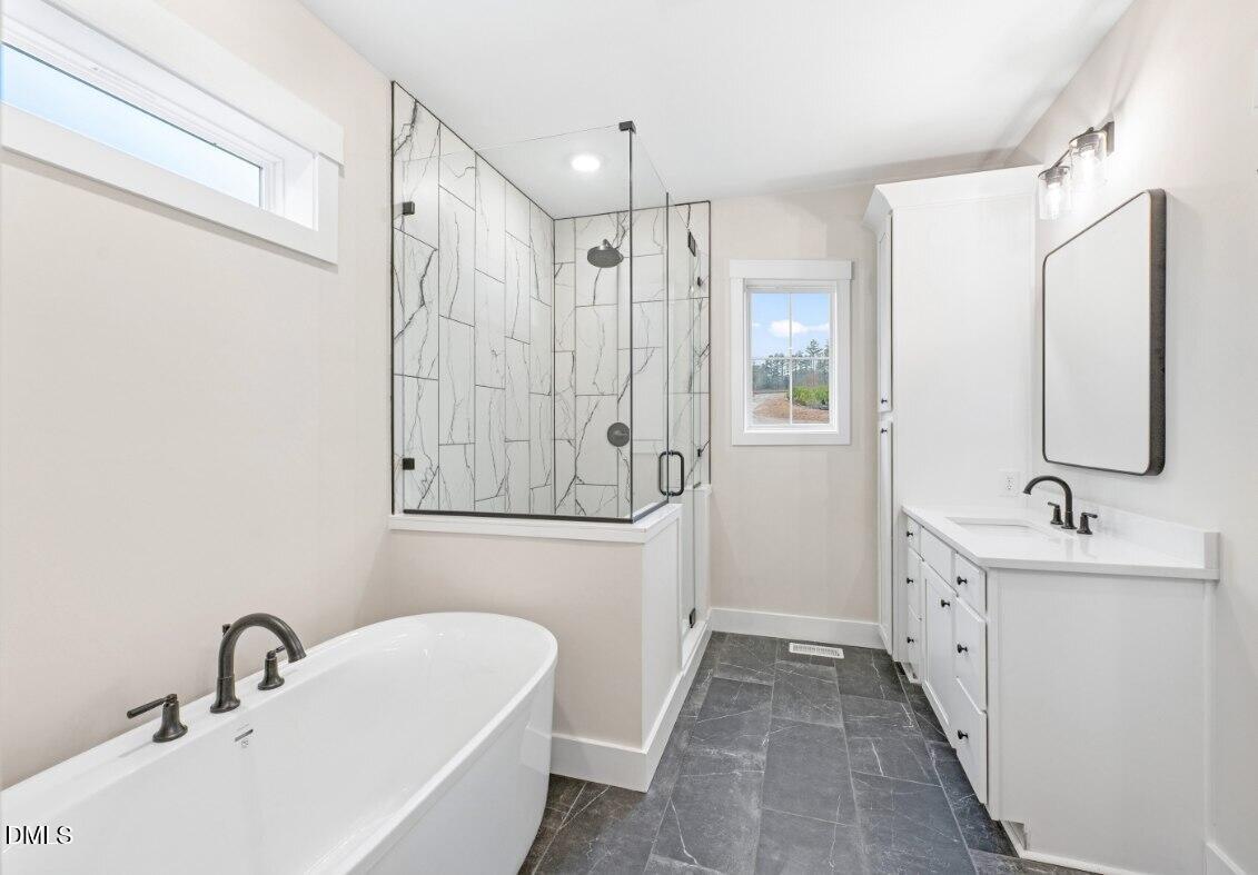 8 Trey Point Dr Spring Spring Hope, NC 27882 - Photo 12 of 31 a bathroom with a double vanity sink mirror and shower
