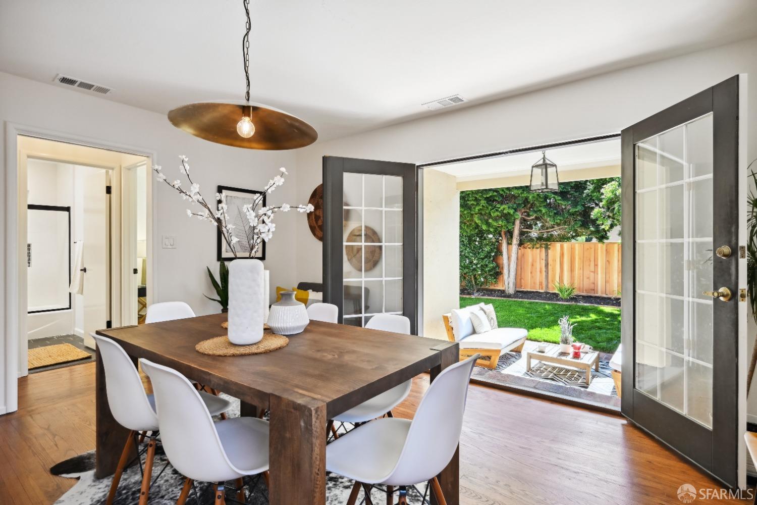 1208 Peach Street Alameda, CA 94501 - Photo 13 of 31 a view of a dining room with furniture window and wooden floor