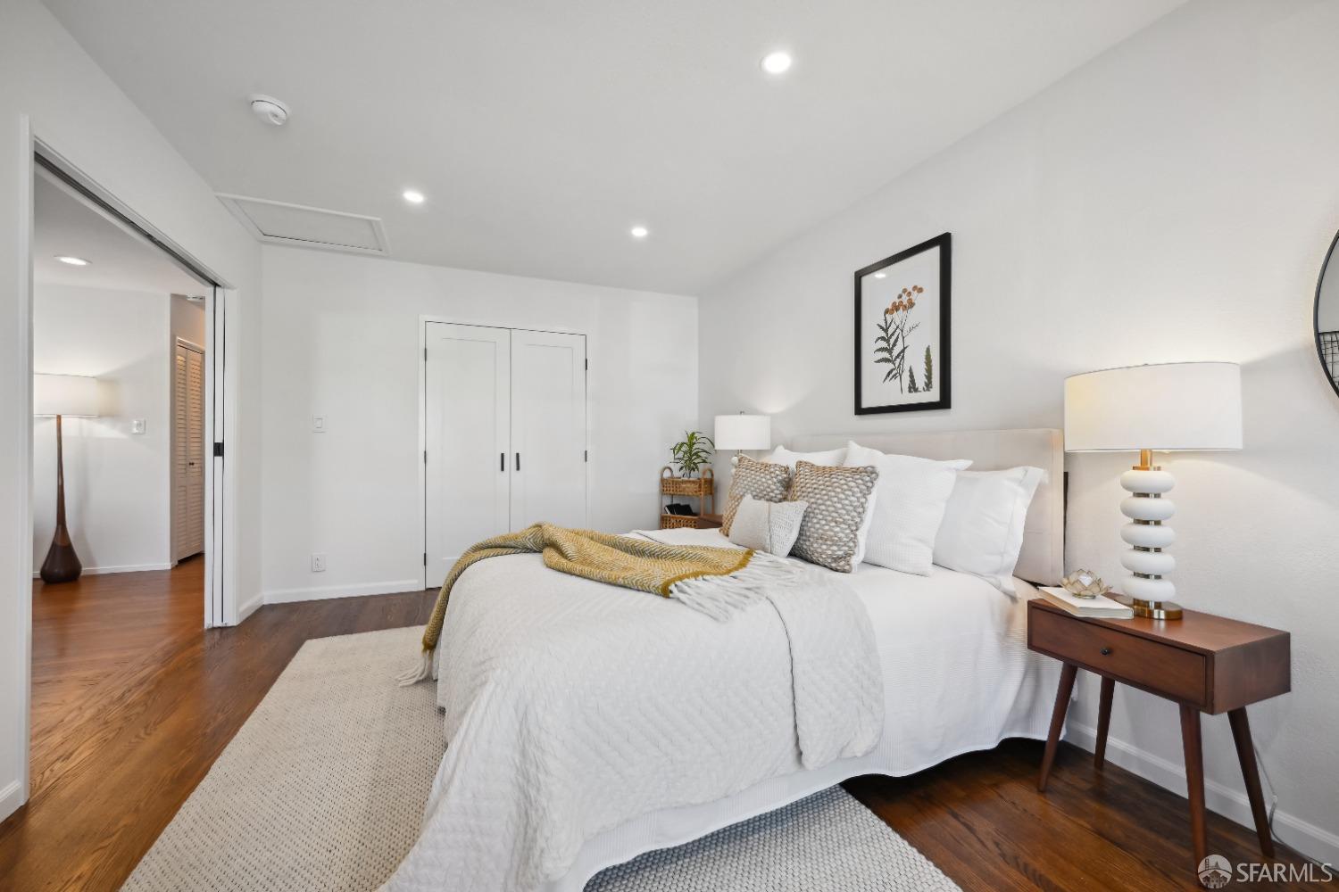 1208 Peach Street Alameda, CA 94501 - Photo 16 of 31 a bedroom with a bed and a lamp