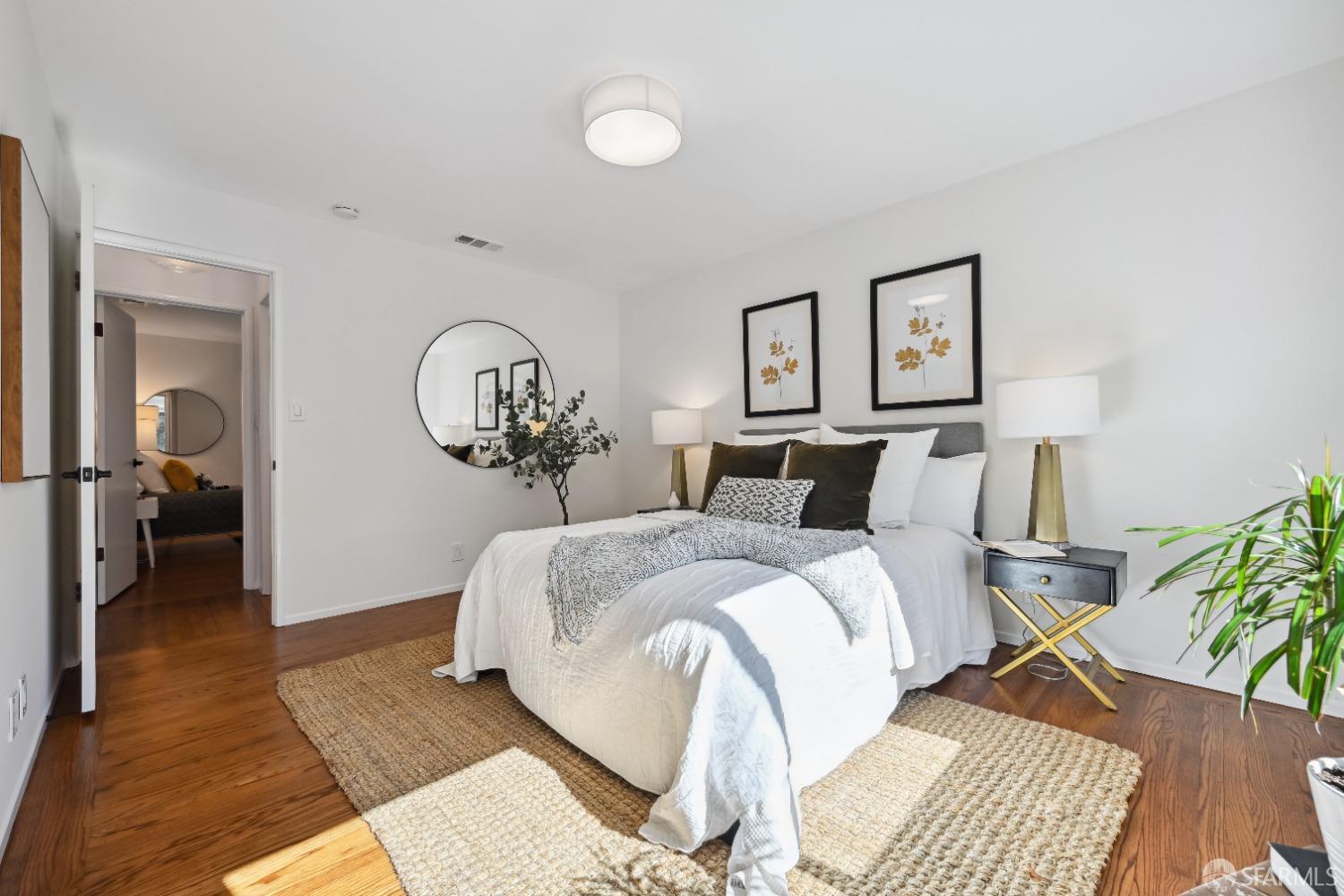 1208 Peach Street Alameda, CA 94501 - Photo 23 of 31 a bed room with a bed and a chandelier