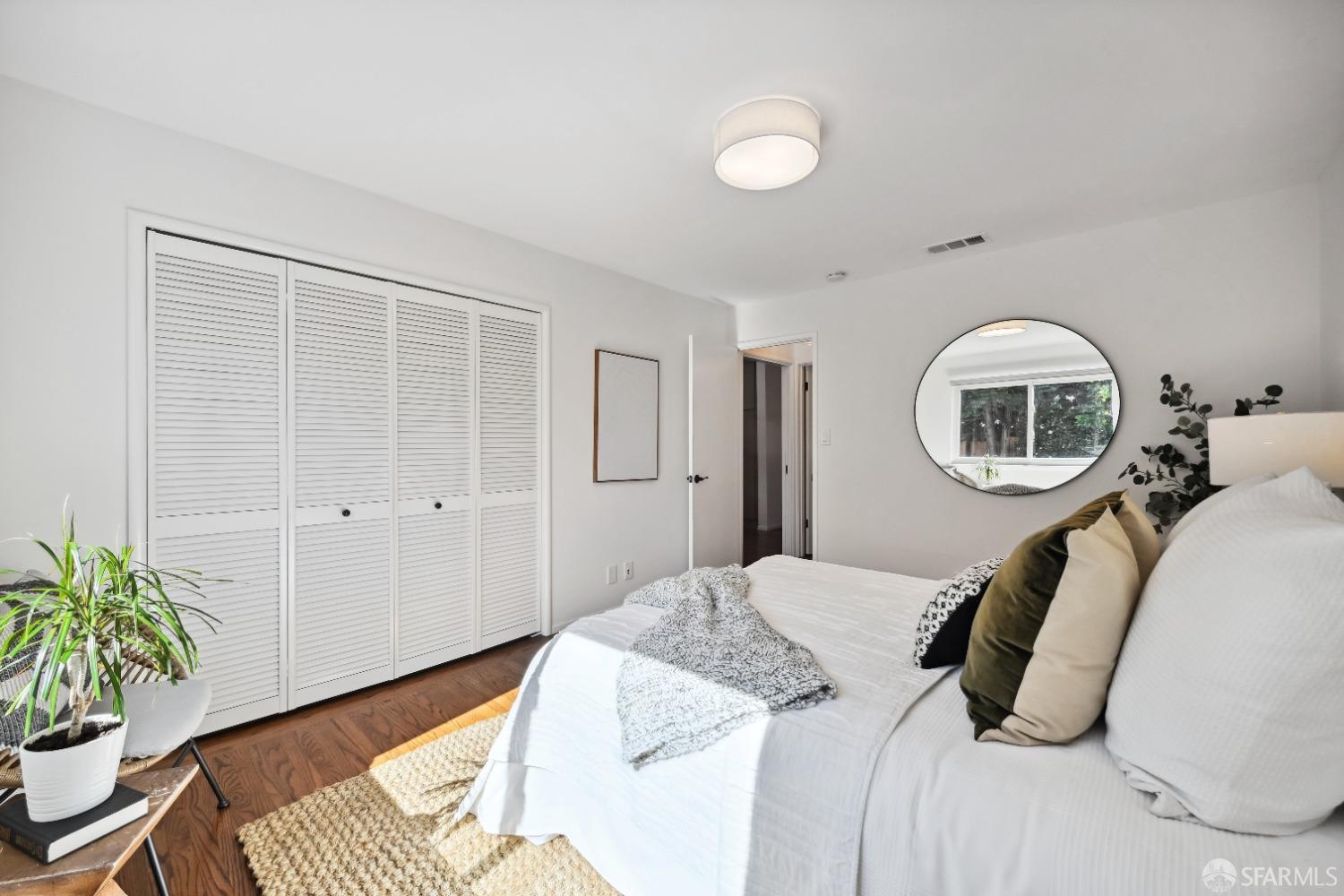 1208 Peach Street Alameda, CA 94501 - Photo 26 of 31 a bedroom with a bed and a potted plant