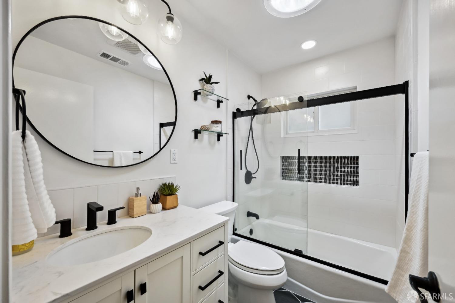 1208 Peach Street Alameda, CA 94501 - Photo 28 of 31 a bathroom with a sink a toilet and a mirror