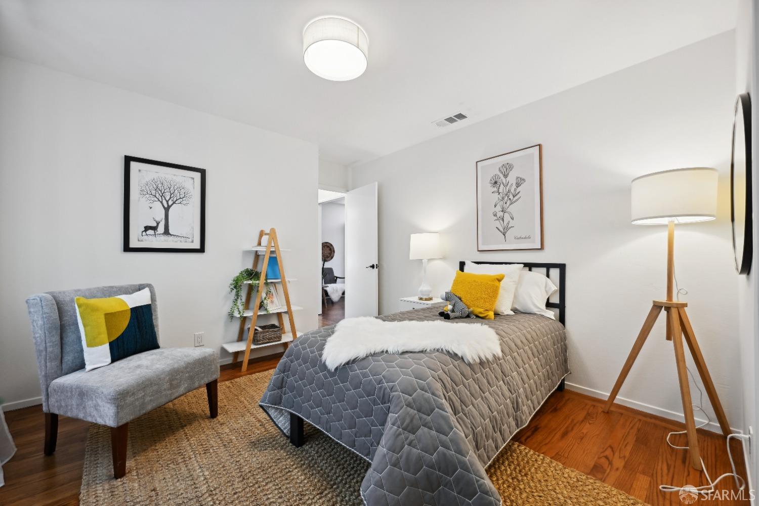 1208 Peach Street Alameda, CA 94501 - Photo 29 of 31 a bedroom with a bed and a couch