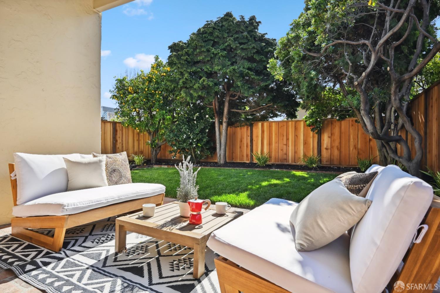 1208 Peach Street Alameda, CA 94501 - Photo 3 of 31 a view of a backyard with couches plants and large tree