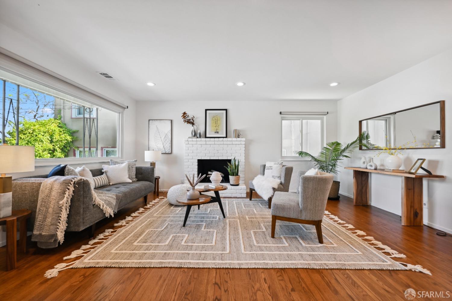 1208 Peach Street Alameda, CA 94501 - Photo 7 of 31 a living room with furniture and a fireplace