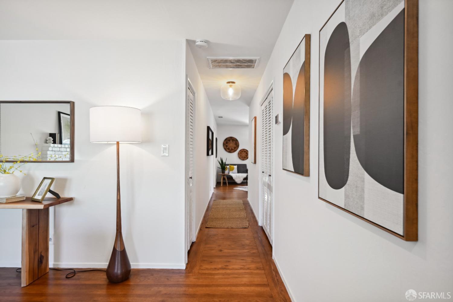 1208 Peach Street Alameda, CA 94501 - Photo 8 of 31 a view of a hallway with wooden floor and staircase