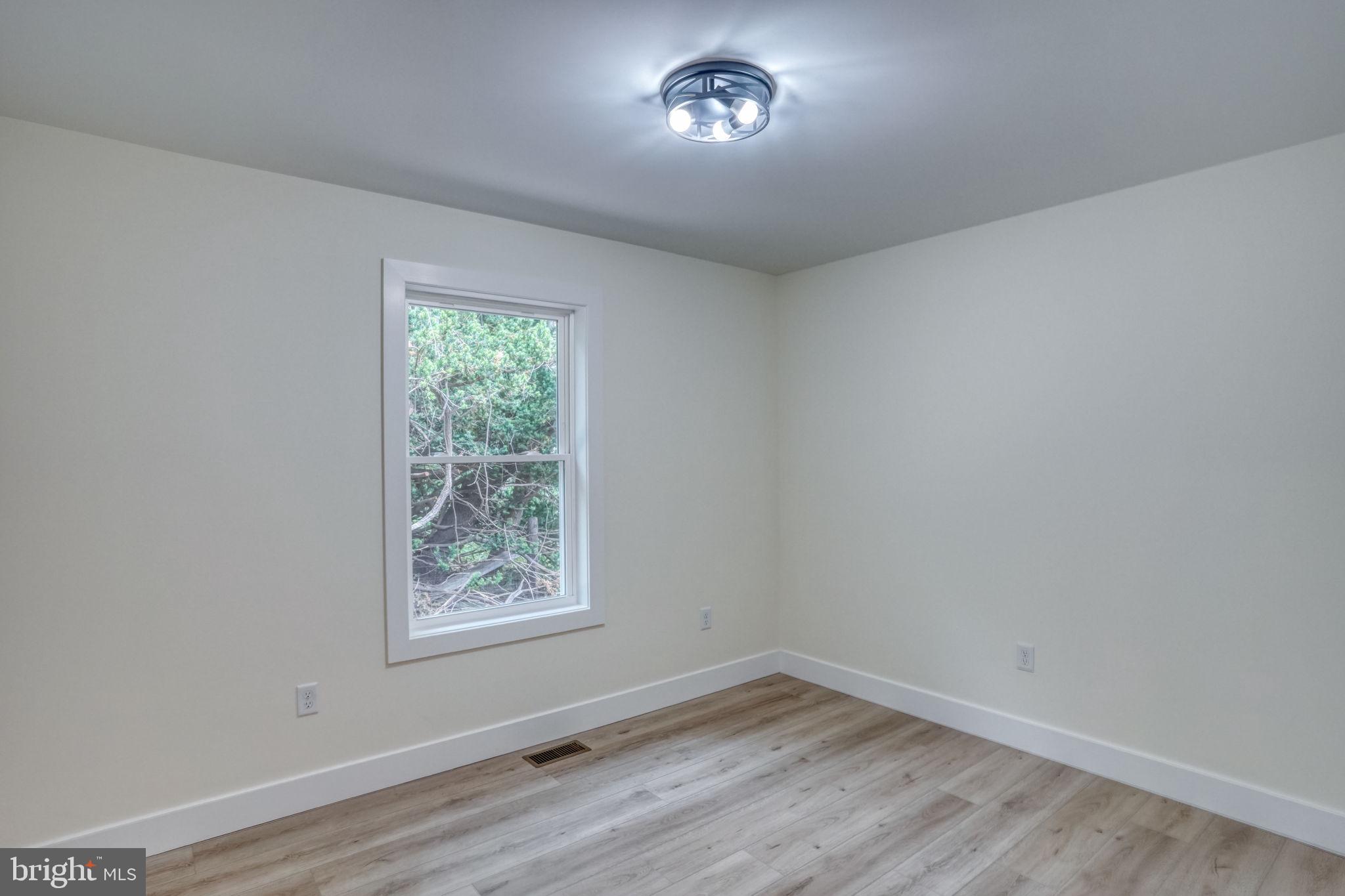 207 Charles Way Georgetown, DE 19947 - Photo 20 of 31 an empty room with a window