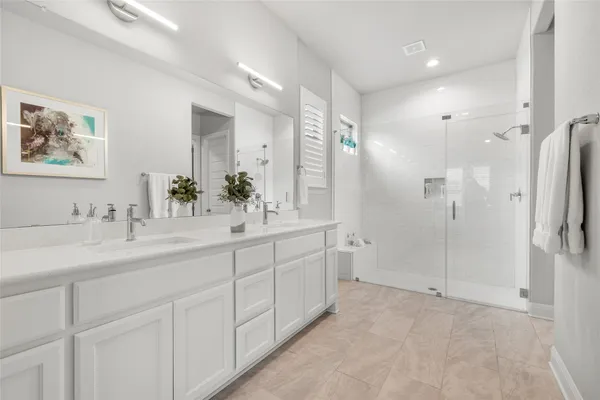 a view of a patio with a table and chairs under an umbrella