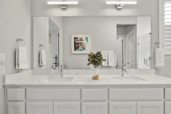 a dining room with furniture water view and a floor to ceiling window