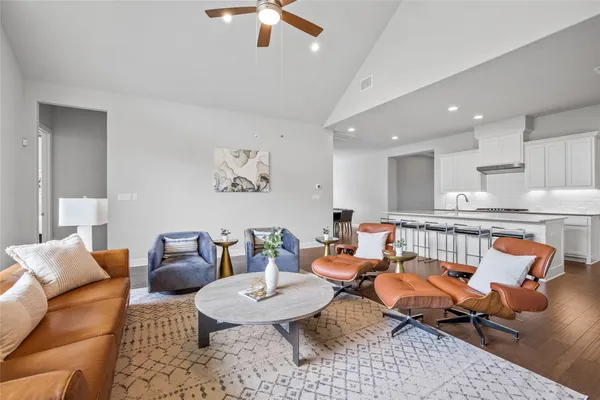 a kitchen with kitchen island a counter top space appliances and cabinets