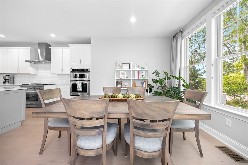 10 Benjamin Lane, Unit 10 Scituate, MA 02066 - Photo 12 of 42 a view of a dining room with furniture and a large window