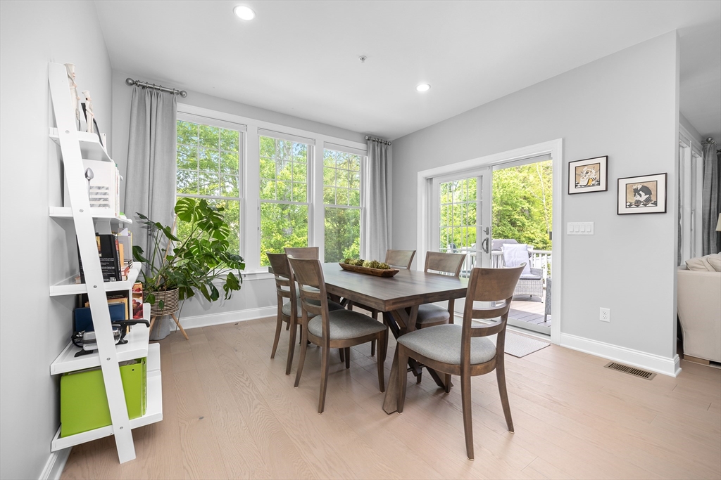 10 Benjamin Lane, Unit 10 Scituate, MA 02066 - Photo 13 of 42 a view of a dining room with furniture window and outside view