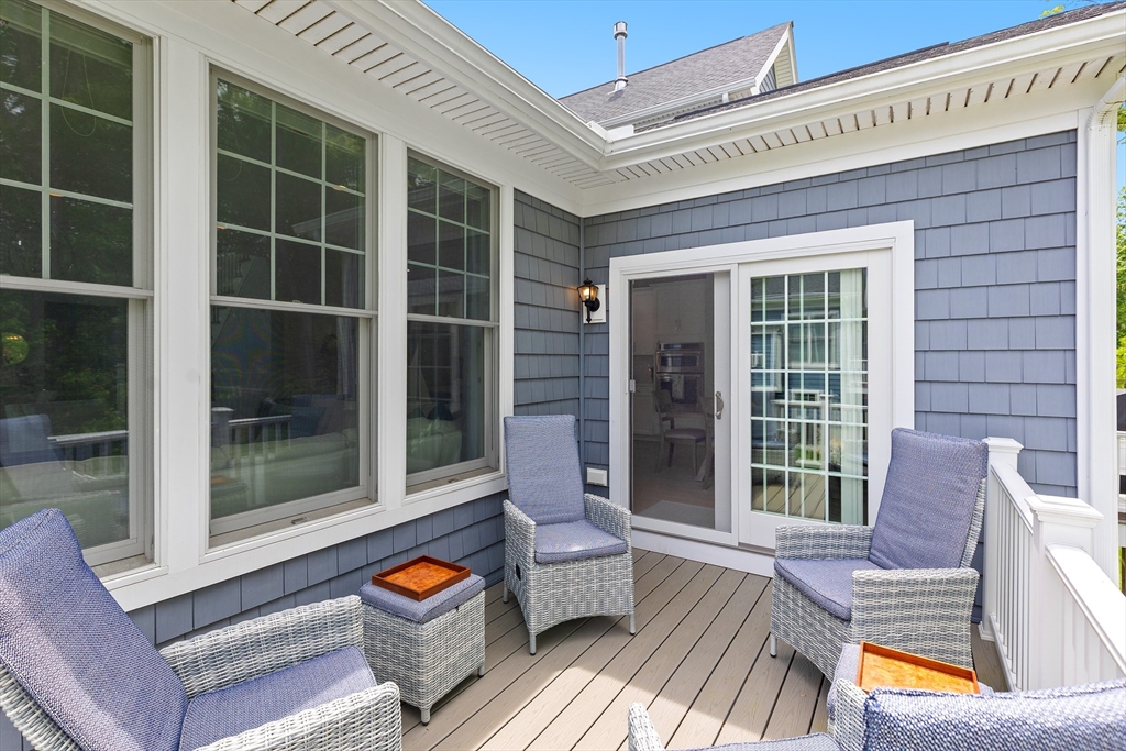 10 Benjamin Lane, Unit 10 Scituate, MA 02066 - Photo 16 of 42 a outdoor living space with patio furniture and potted plants