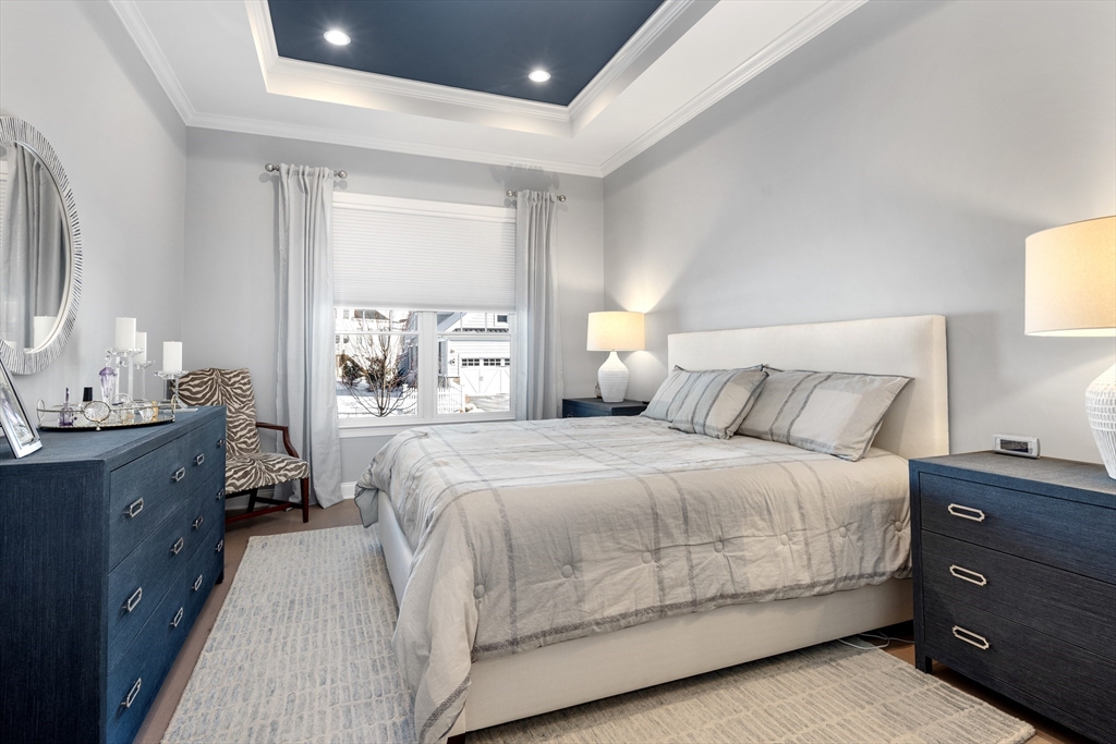 10 Benjamin Lane, Unit 10 Scituate, MA 02066 - Photo 17 of 42 a bedroom with a bed and a window