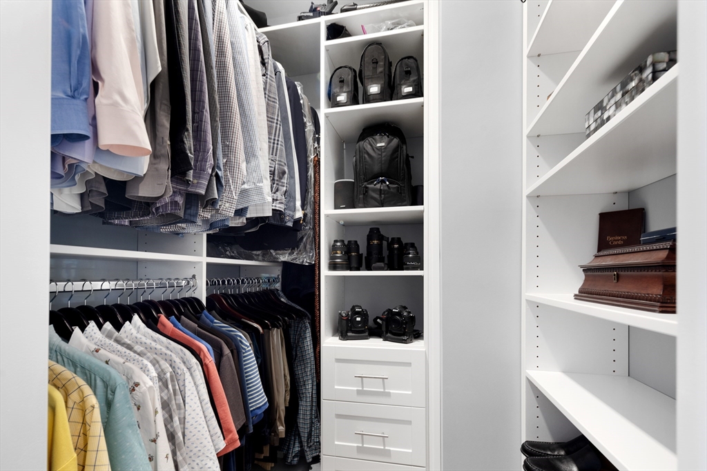 10 Benjamin Lane, Unit 10 Scituate, MA 02066 - Photo 20 of 42 a view of walk in closet with clothes and shoes
