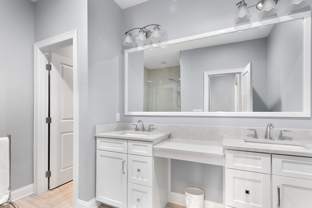 10 Benjamin Lane, Unit 10 Scituate, MA 02066 - Photo 21 of 42 a bathroom with a sink and a mirror
