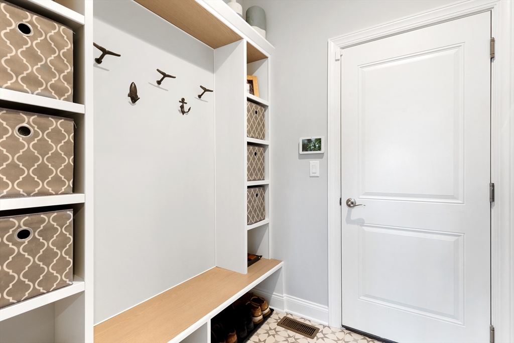 10 Benjamin Lane, Unit 10 Scituate, MA 02066 - Photo 29 of 42 a room with table and closet