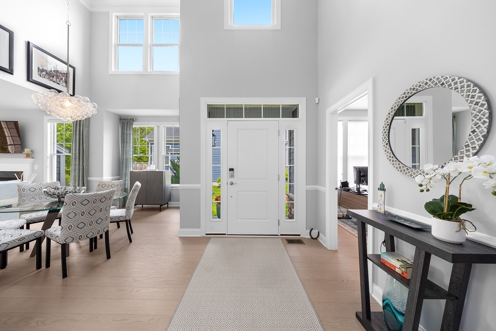 10 Benjamin Lane, Unit 10 Scituate, MA 02066 - Photo 3 of 42 a living room with furniture and wooden floor
