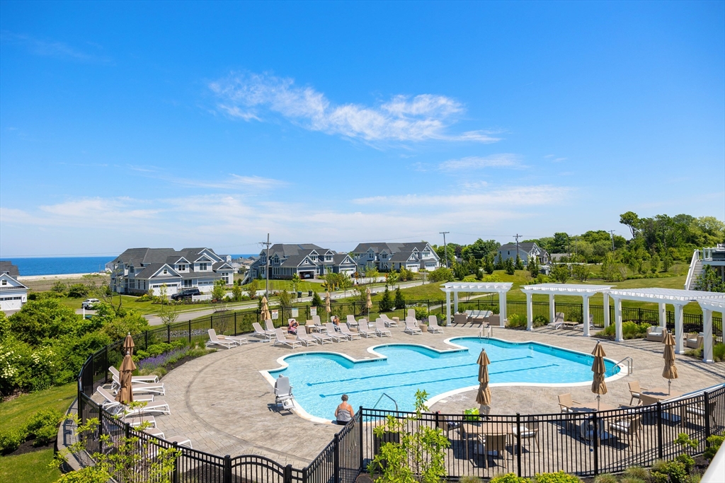 10 Benjamin Lane, Unit 10 Scituate, MA 02066 - Photo 32 of 42 a view of a balcony with table and chairs