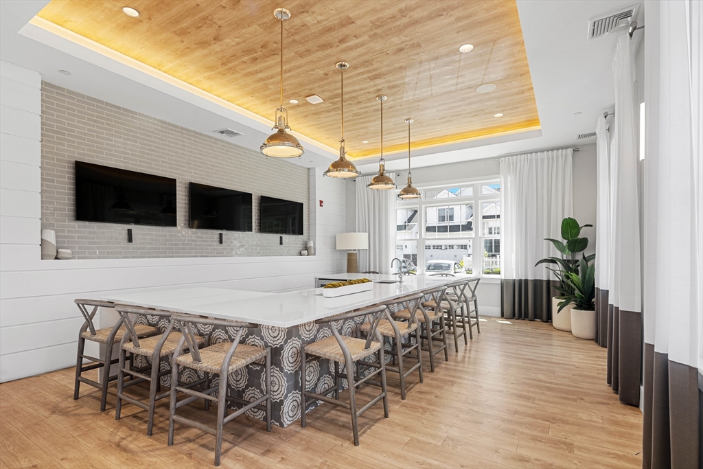 10 Benjamin Lane, Unit 10 Scituate, MA 02066 - Photo 35 of 42 a view of a chairs and table in the patio