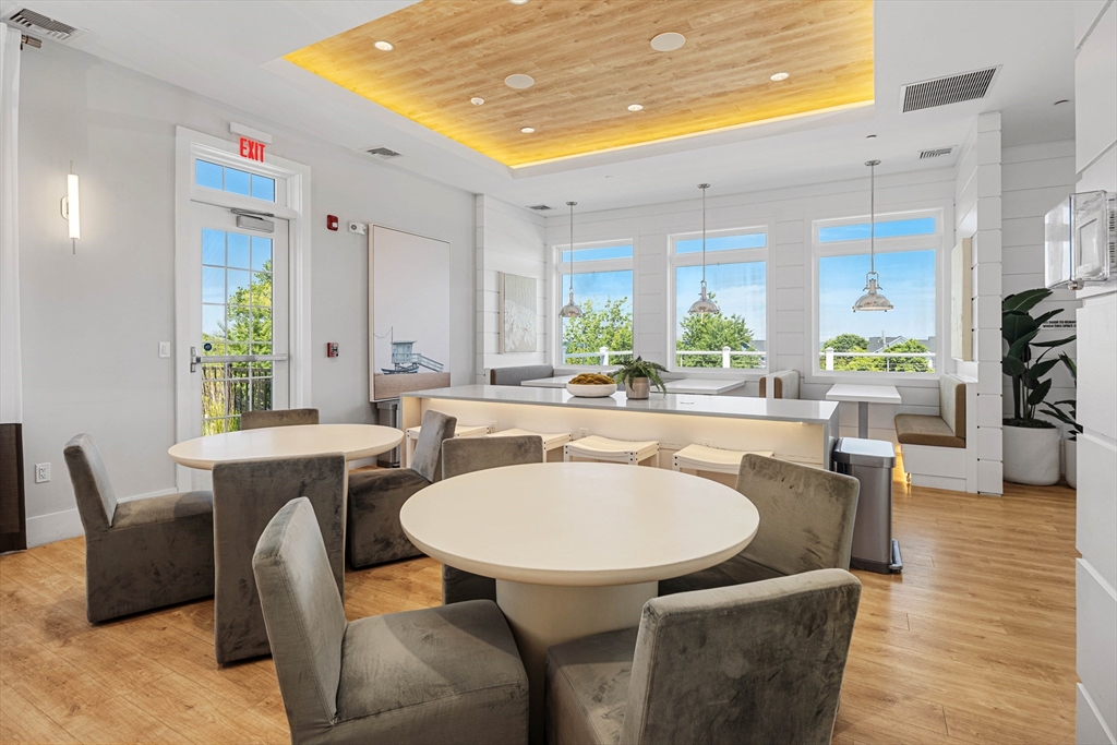 10 Benjamin Lane, Unit 10 Scituate, MA 02066 - Photo 36 of 42 a view of a dining room with furniture and wooden floor