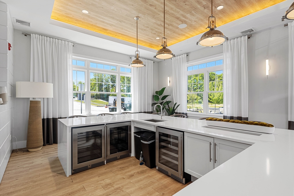 10 Benjamin Lane, Unit 10 Scituate, MA 02066 - Photo 37 of 42 a kitchen with a sink stove and cabinets