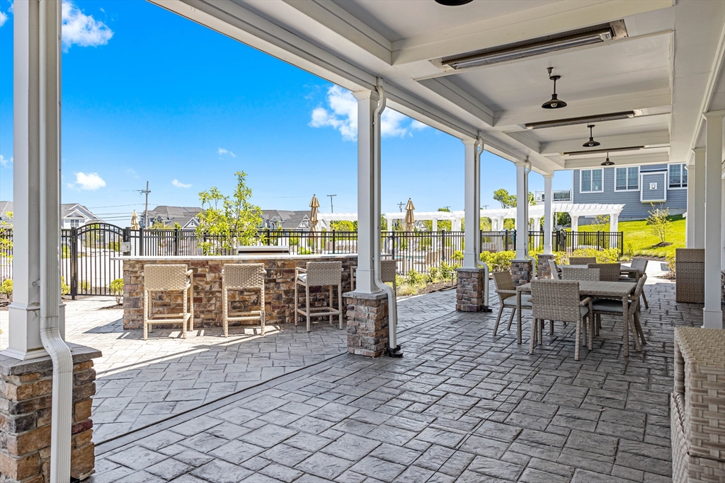 10 Benjamin Lane, Unit 10 Scituate, MA 02066 - Photo 38 of 42 a outdoor space with lots of tables a garden and chairs