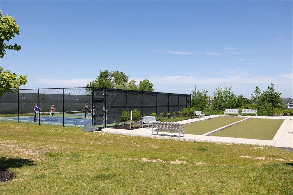 10 Benjamin Lane, Unit 10 Scituate, MA 02066 - Photo 41 of 42 a view of swimming pool with outdoor seating and covered with green space