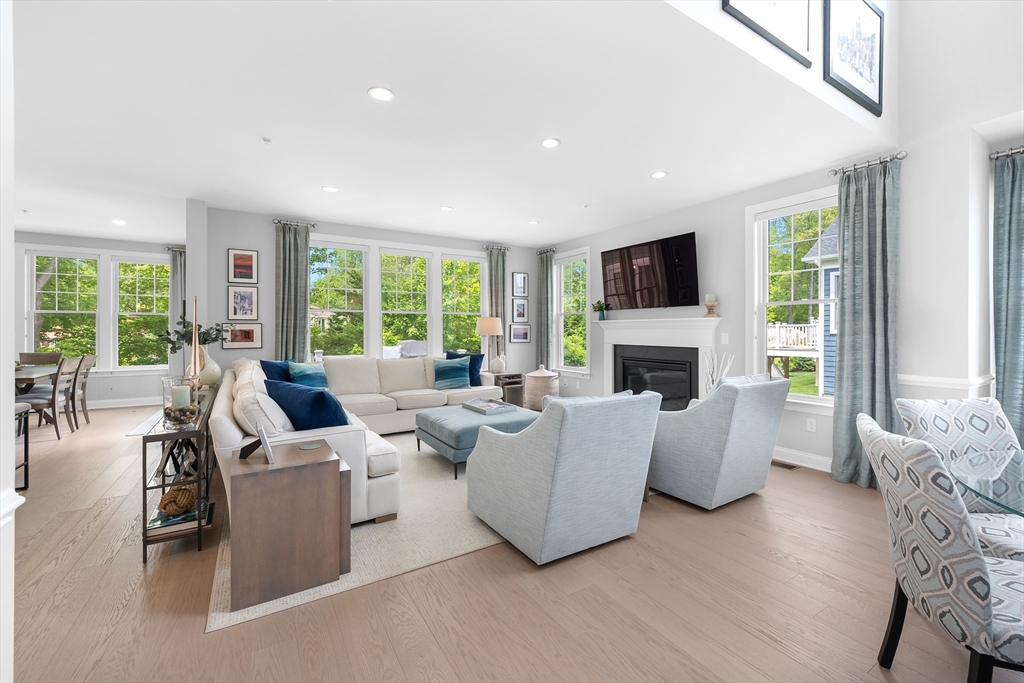 10 Benjamin Lane, Unit 10 Scituate, MA 02066 - Photo 7 of 42 a living room with fireplace furniture and a flat screen tv