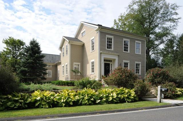 a front view of a house with a yard