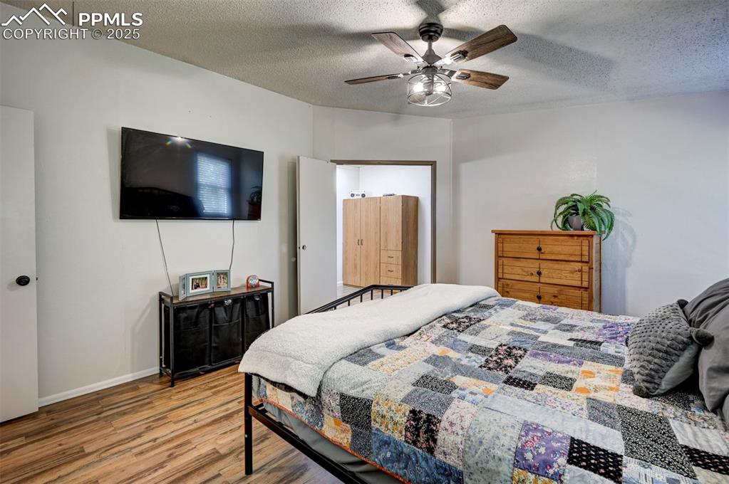 35355 Funk Road Calhan, CO 80808 - Photo 21 of 31 a bedroom with a bed and a flat screen tv