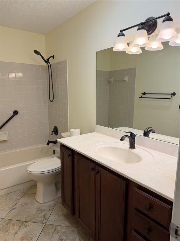 9529 Southwest 85th Avenue, Unit D Ocala, FL 34481 - Photo 17 of 21 a bathroom with a sink a toilet and shower