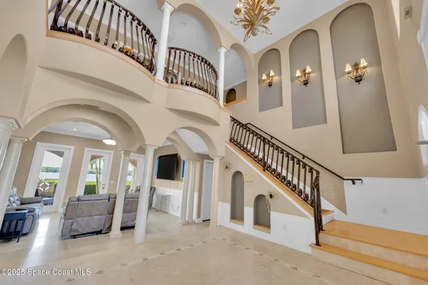 a living room with fireplace furniture and a fireplace