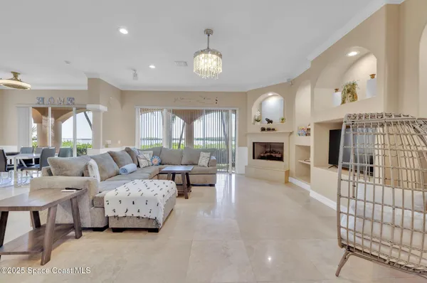 a kitchen with kitchen island granite countertop a sink a counter space appliances and cabinets