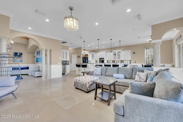 a large kitchen with stainless steel appliances granite countertop a lot of counter space and a sink