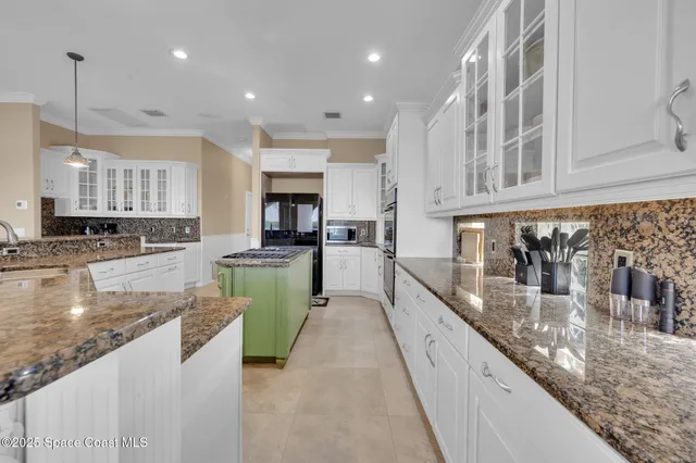 a spacious bedroom with a large bed and a large window