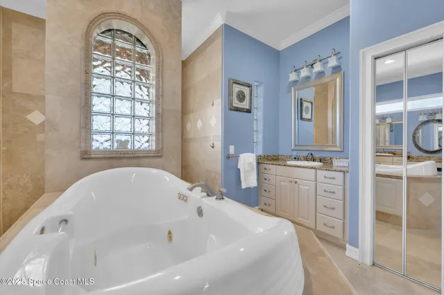 a bedroom with two beds and a dresser