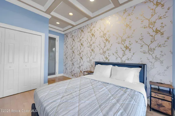 a spacious bathroom with a granite countertop sink and a mirror