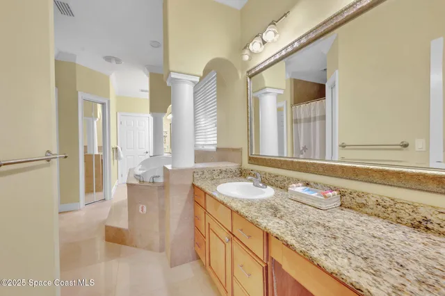 an aerial view of a houses with outdoor space and swimming pool