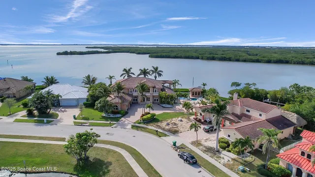 an aerial view of a house with a garden and plants