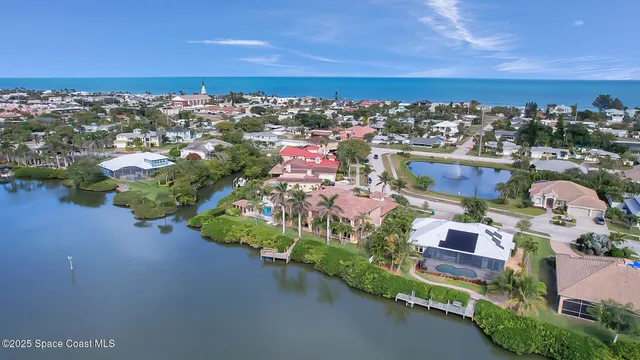 an aerial view of a houses with outdoor space and street view