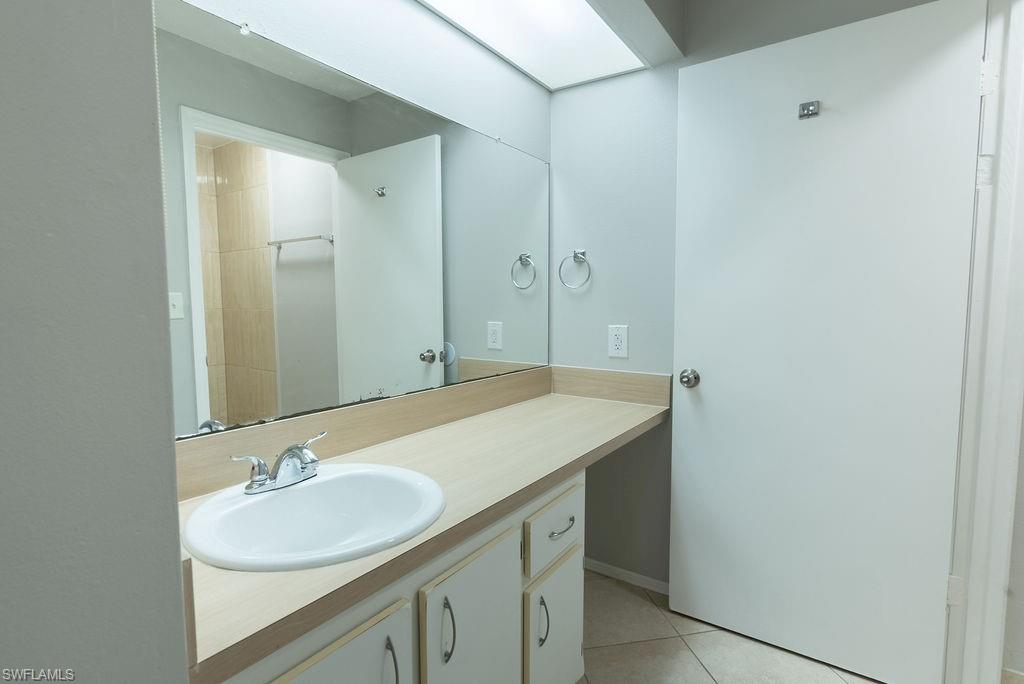 2045 Rookery Bay Drive, Unit 1901 Naples, FL 34114 - Photo 13 of 18 Bathroom featuring light tile patterned flooring and vanity