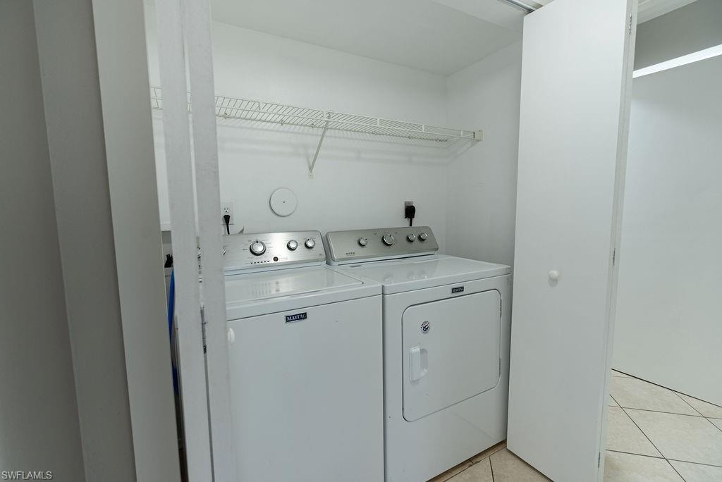 2045 Rookery Bay Drive, Unit 1901 Naples, FL 34114 - Photo 15 of 18 Laundry room featuring light tile patterned flooring and independent washer and dryer