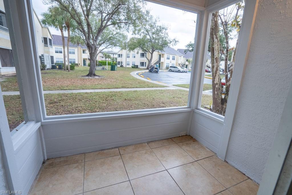 2045 Rookery Bay Drive, Unit 1901 Naples, FL 34114 - Photo 18 of 18 Unfurnished sunroom featuring plenty of natural light