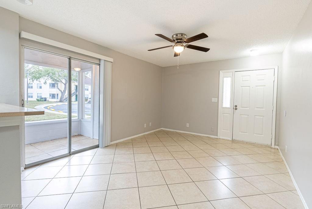 2045 Rookery Bay Drive, Unit 1901 Naples, FL 34114 - Photo 7 of 18 Spare room featuring ceiling fan and light tile patterned floors