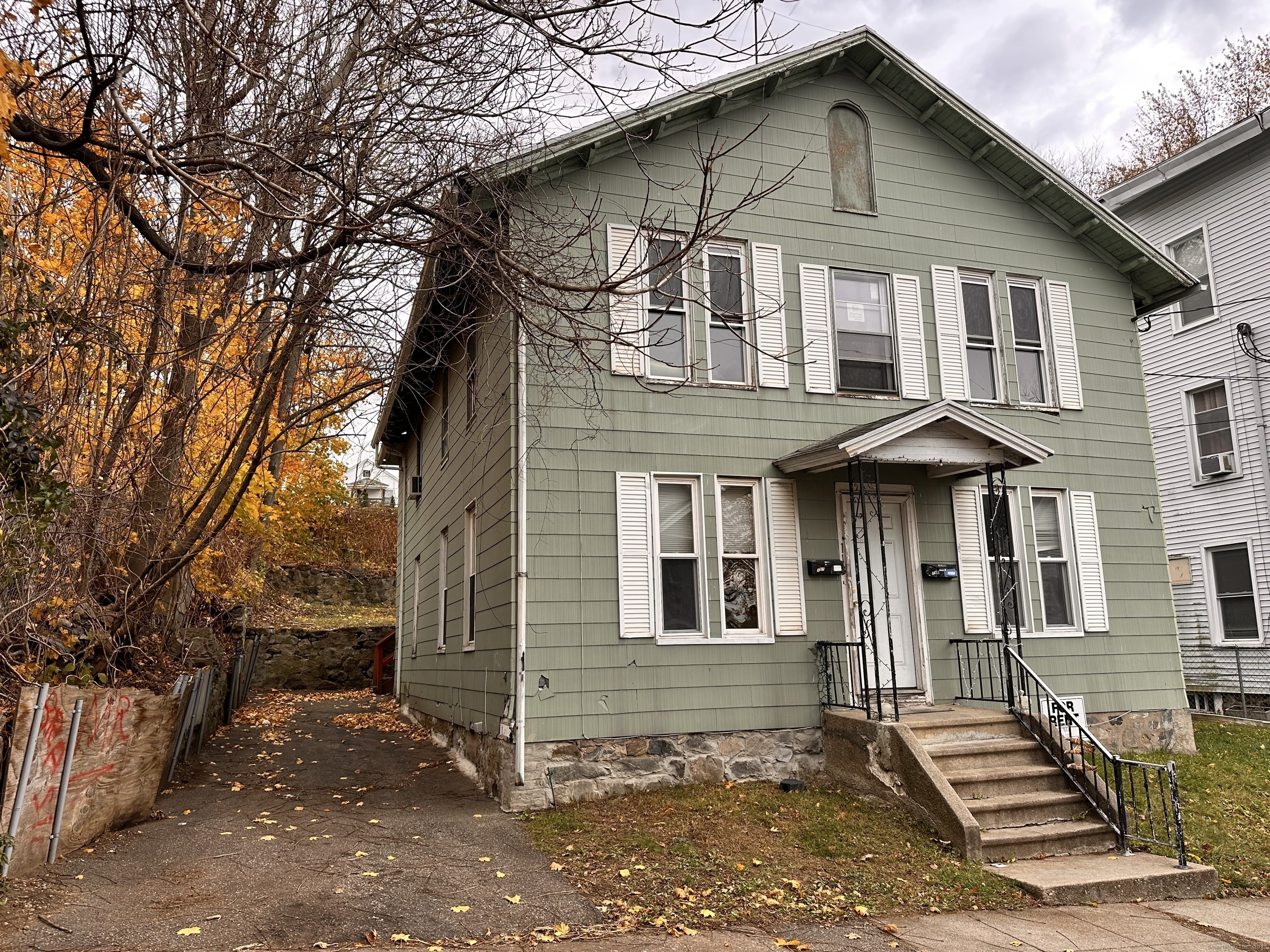 113 Southview Street Waterbury, CT 06706 - Photo 1 of 6 a front view of a house with a yard