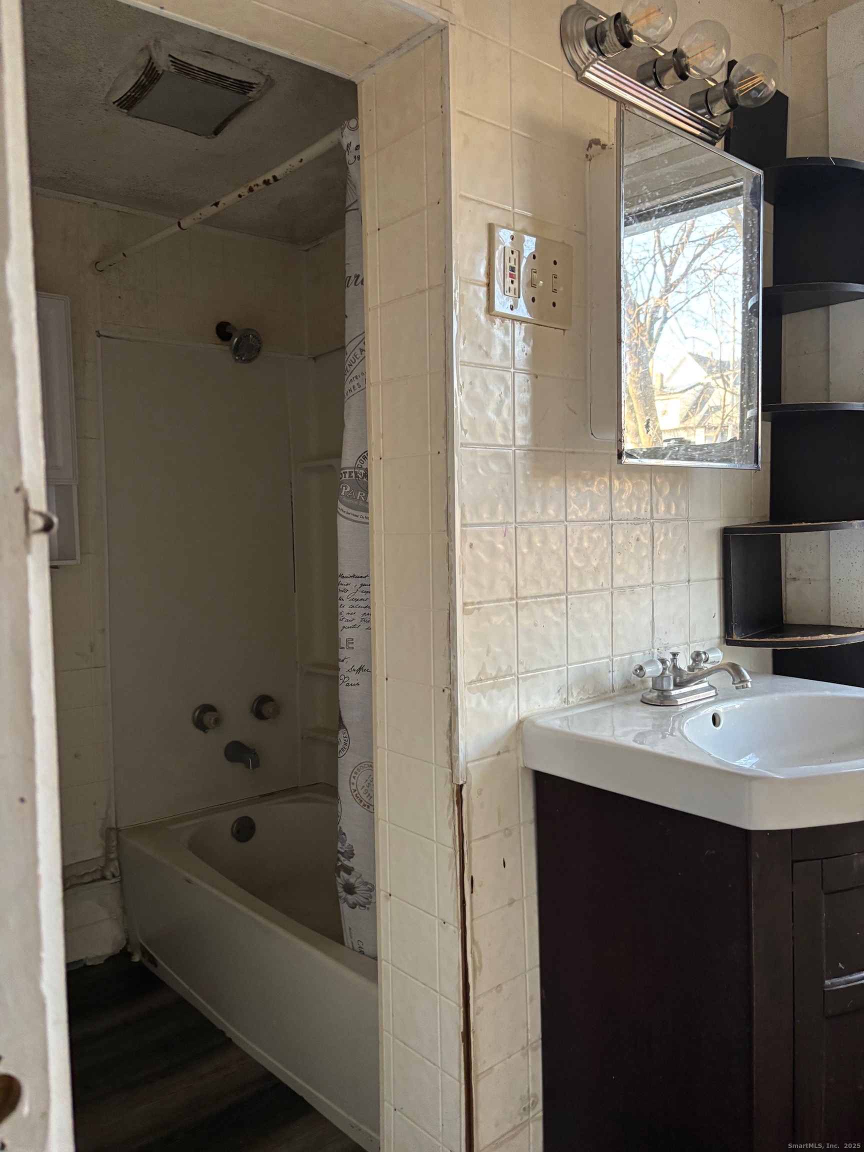 113 Southview Street Waterbury, CT 06706 - Photo 6 of 6 a bathroom with a tub sink and mirror