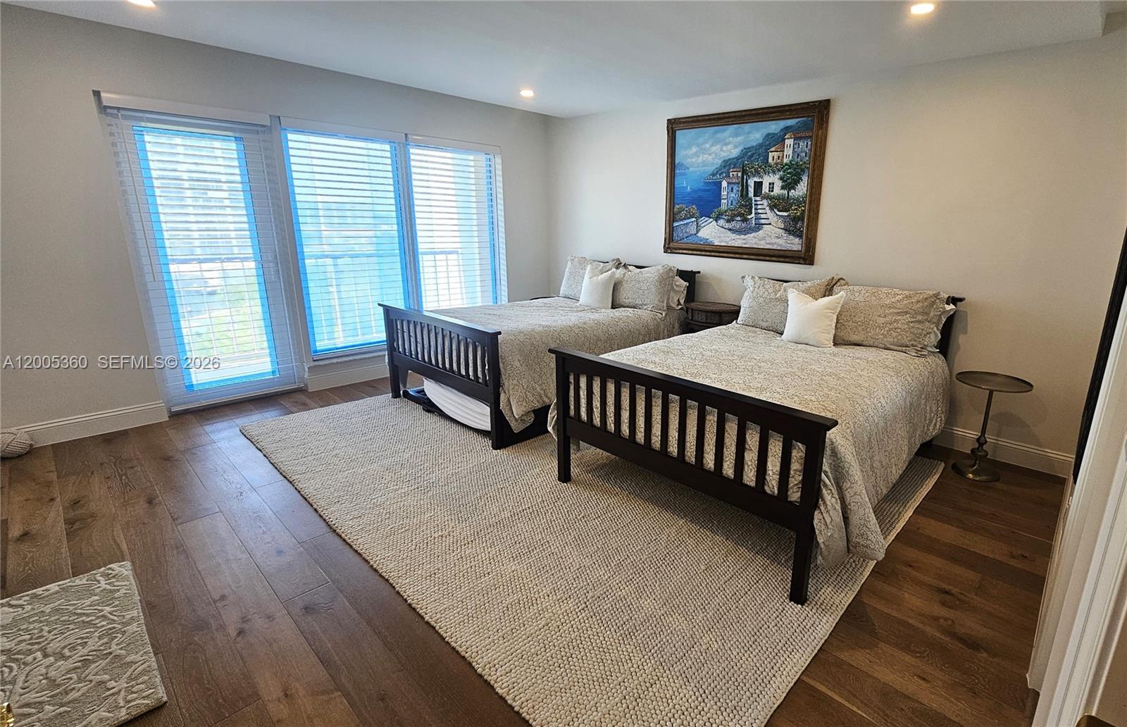 4001 North Ocean Boulevard, Unit 702 Boca Raton, FL 33431 - Photo 22 of 56 a spacious bedroom with two beds and a large window
